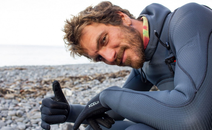Surfer wearing an Xcel Comp X hooded chest zip wetsuit