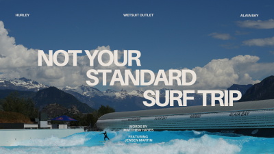 Surfer riding a wave at the Alaïa Bay wave pool beneath the snow-capped Swiss Alps