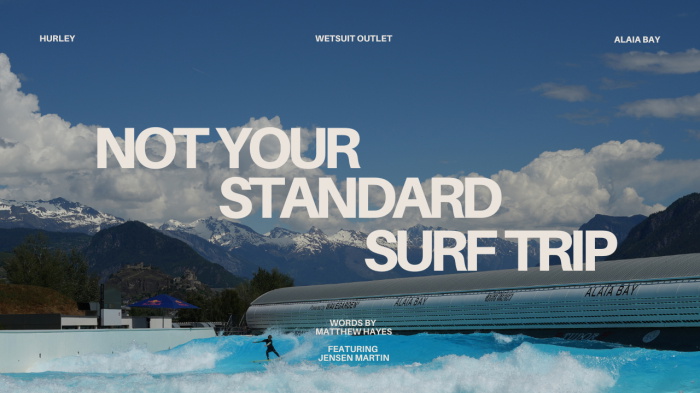 Surfer riding a wave at the Alaïa Bay wave pool beneath the snow-capped Swiss Alps