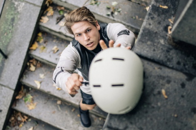 Surfer wearing a Mystic Legacy watersports helmet