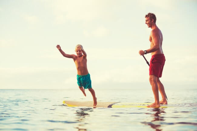 Dad and son playing in the sea